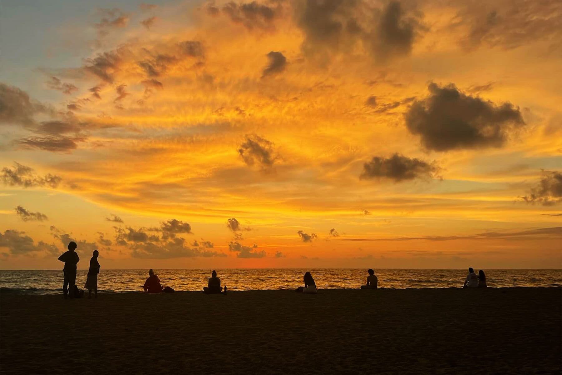 silhouettes of people on the beach at sunset, puerto escondido